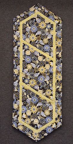 Tablerunner - machine quilted, yellow with flowers on black 18 x 51