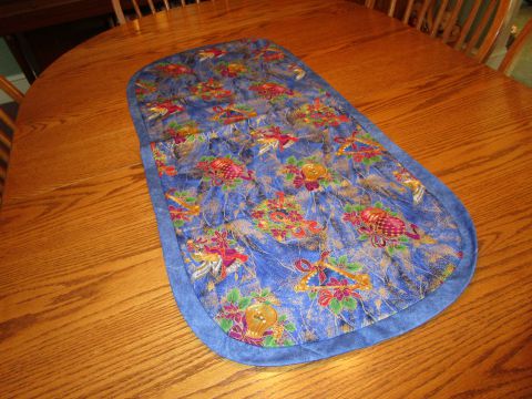 Table topper – unquilted 18” x 40” large Christmas print in blues.