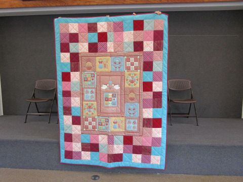 Quilt – Country Print 60” x 80” short twin/lap robe.  Teal with country colors.