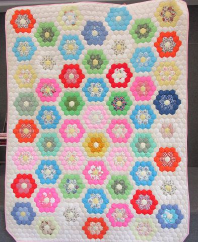 Quilt – Grandmothers Flower Garden, 64” x 80” twin size.  Multi color on off-white background