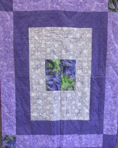 Comforter – 60” x 80” Purple. Pieced by Beverly Critchfield. Knotted and bound by Daughters of Dorcas